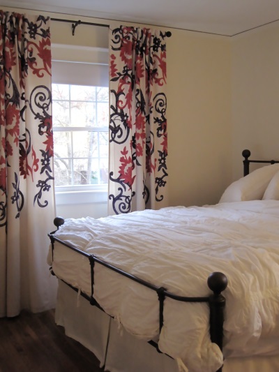 These drapes add THE perfect dose of pattern and color in an otherwise soothing and neutral space.